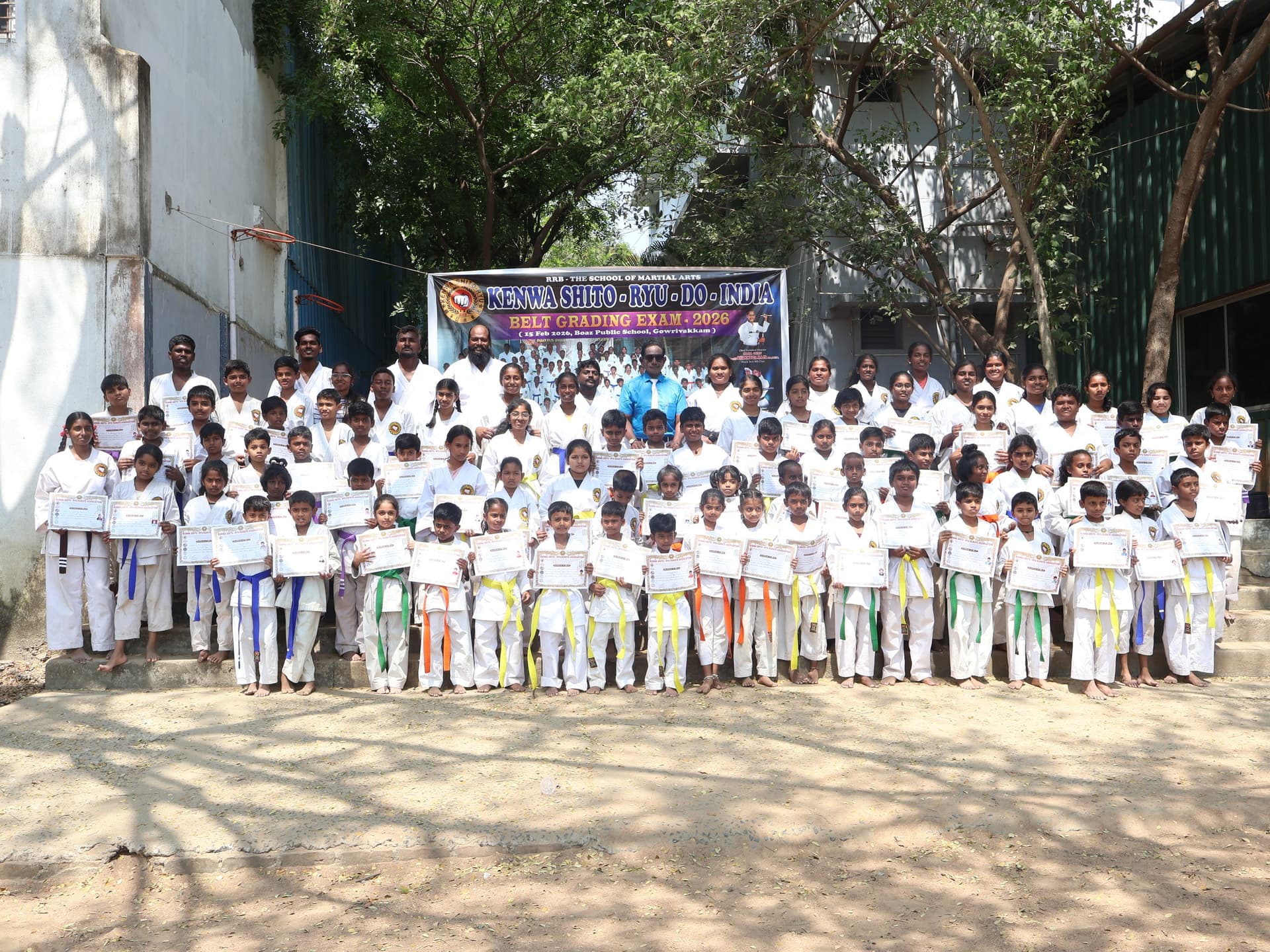 Karate students taking belt grading examination at Tamil martial arts center