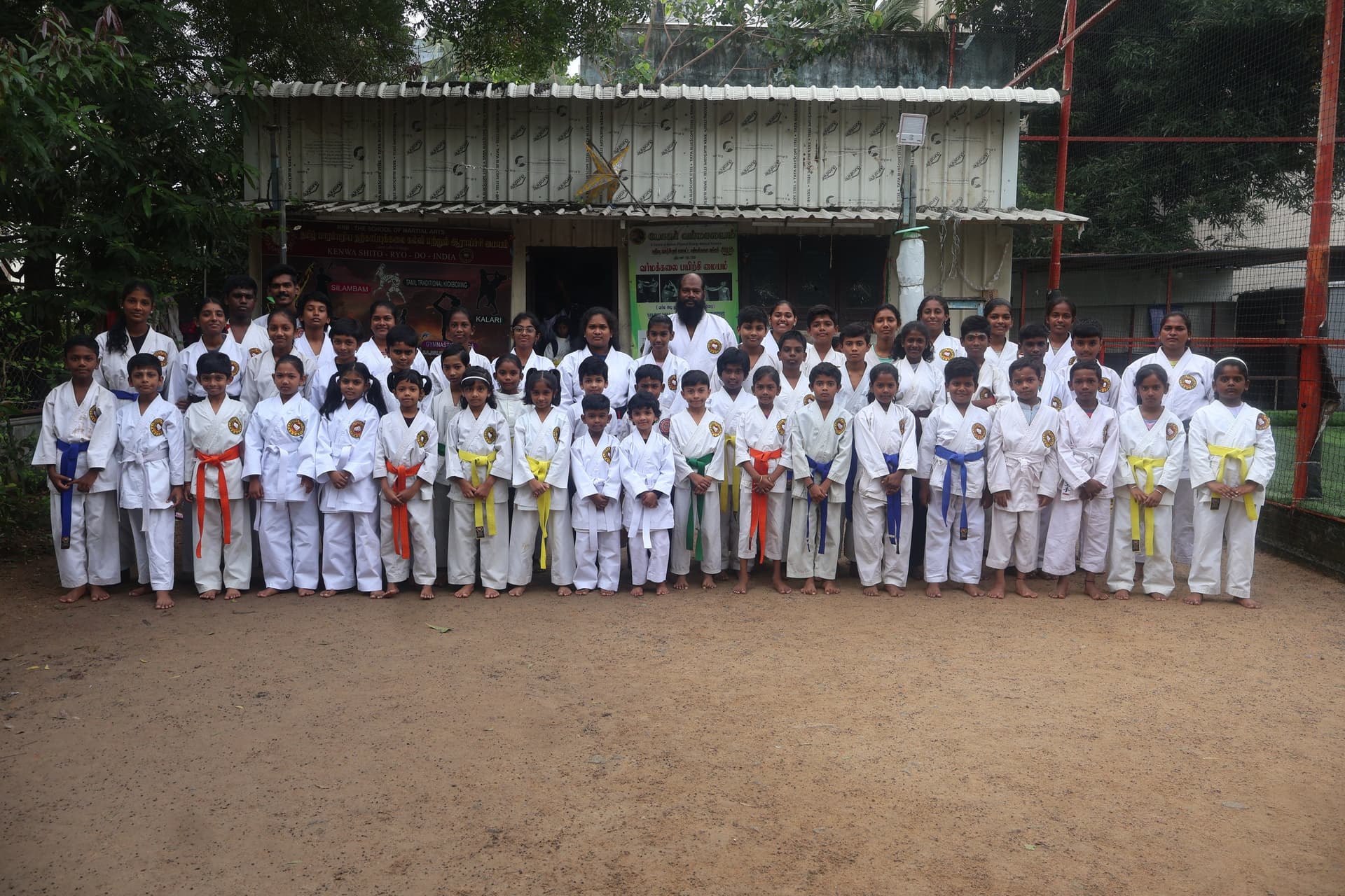 Karate students assembled for group photo after completing belt grading examination