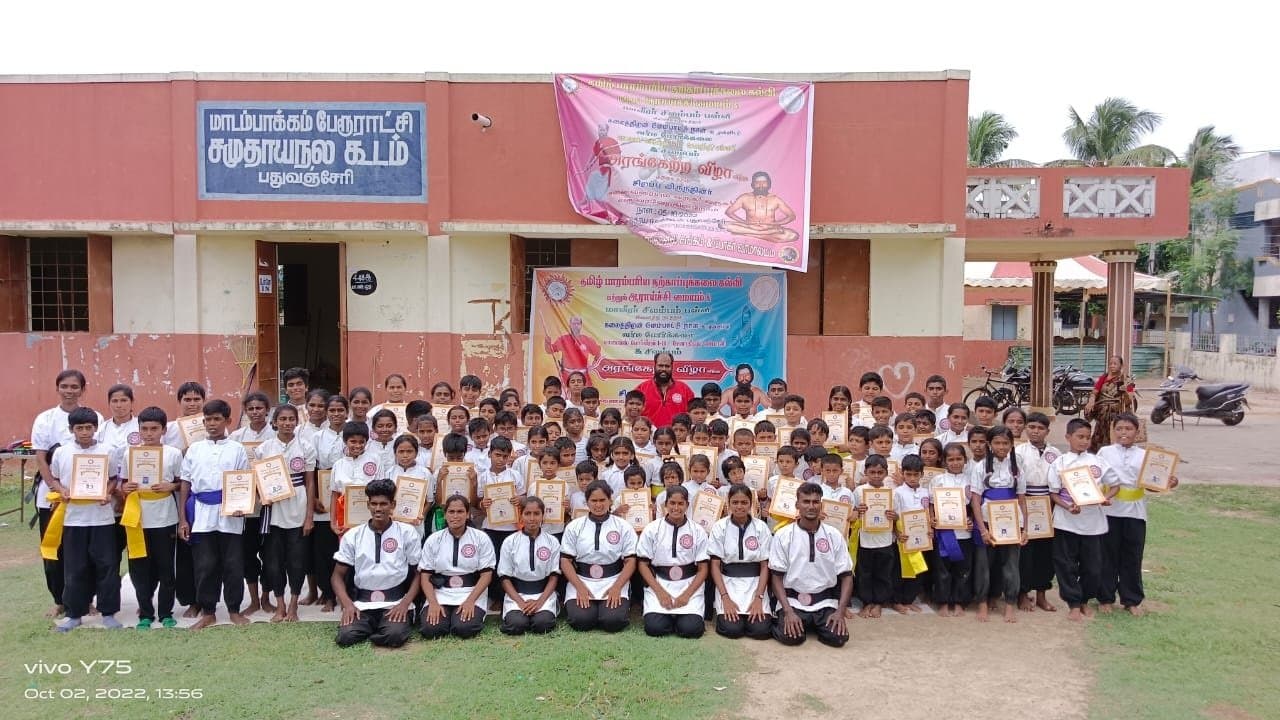 Silambam students arranged in disciplined formation during training session